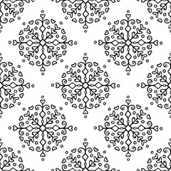 Vector seamless pattern with hand drawn snowflakes in Scandinavian style. Design for Christmas wrapping paper, textile and backgrounds.