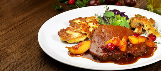 Roasted Deer Haunch Slice with Potato - caramelized Cranberries  and Apricots