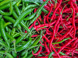 two different and separate types of chilies, red chilies and green chilies