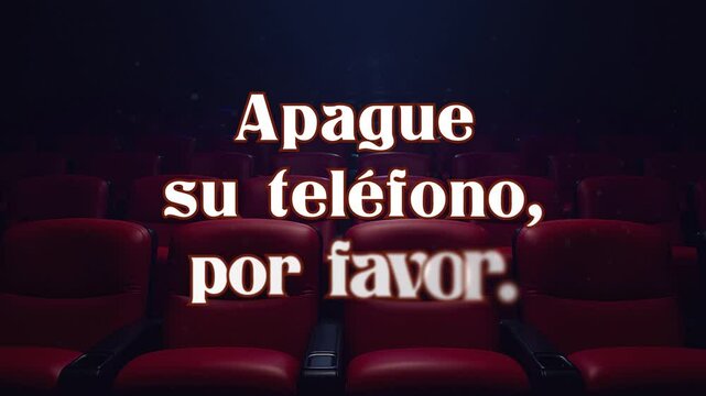Text message appearing and dissolving on front shot of chairs in cinema: Apague su Tel&eacute;fono, por favor (Spanish: please silence your phone). Blue lighting above, floating dust particles.
