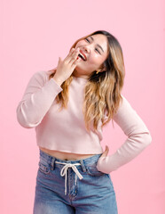 Half body photo cute happy fun young Asian beautiful female, woman smiling in light pink long-sleeve shirt poses isolated plain pastel light over pink color wall background