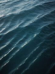 Waves cascade in rhythmic blues across the ocean&rsquo;s expanse.