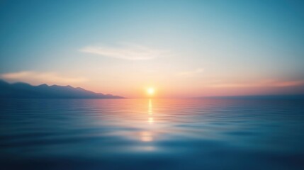 Fototapeta premium Sunset over ocean with mountains