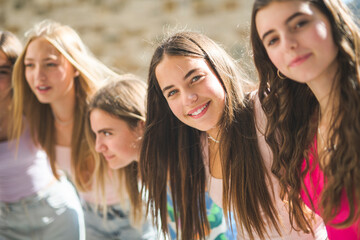 Happy teenagers or childs having fun together on city background