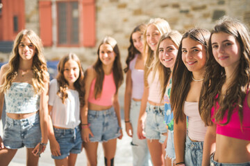 Happy teenagers or childs having fun together on city background