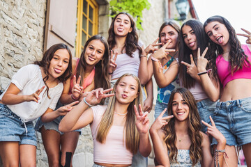 Happy teenagers or childs having fun together on city background