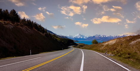 The road way  travel with mountain landscape view of blue sky background over Aoraki mount cook national park,New zealand