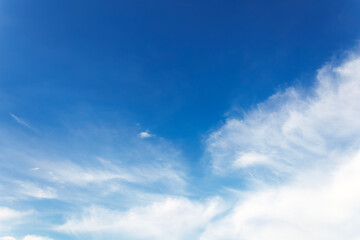 Soft gentle blue sky with light clouds. Calm texture. Nature abstract background. Fresh air, weather and freedom concept.