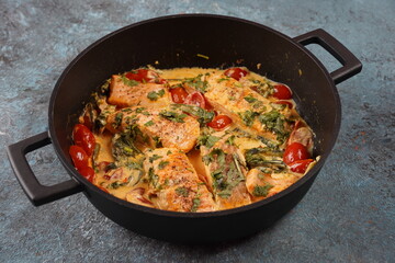 Tuscan creamy salmon with spinach and cherry tomatoes in creamy sauce