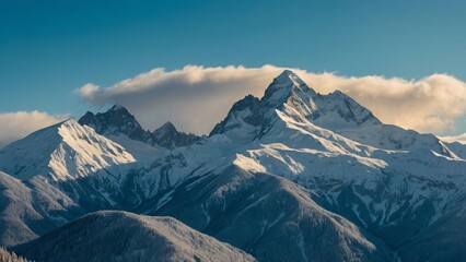A mountain range landscape with snow on the peaks