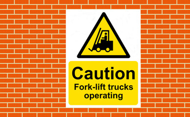 Obraz premium Caution Fork-lift trucks operating sign on a wall