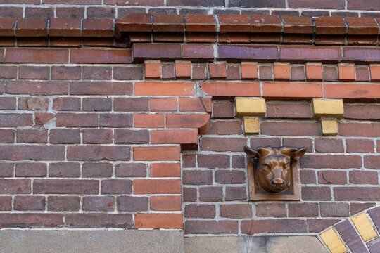 Brick facade with dentils and ox head
