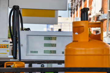 liquified gas bottles, Liquefied Gas Cylinder, at a gas petrol station for refill , next to petrol...