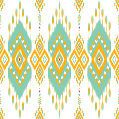 Bright and colorful Ikat pattern featuring teal, yellow, and pink geometric diamonds and tribal motifs on a white background. Ideal for fabric, home decor, and fashion with a modern tribal-inspired