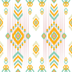 Bright and colorful Ikat pattern featuring teal, yellow, and pink geometric diamonds and tribal motifs on a white background. Ideal for fabric, home decor, and fashion with a modern tribal-inspired