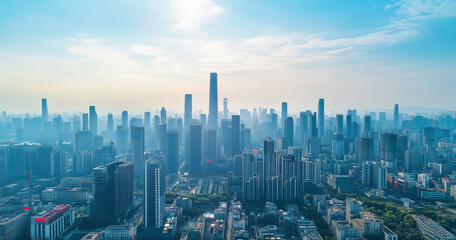 Obraz premium Aerial View of City Skyline and Skyscrapers Under Blue Sky and White Clouds