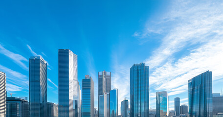 Aerial View of City Skyline and Skyscrapers Under Blue Sky and White Clouds