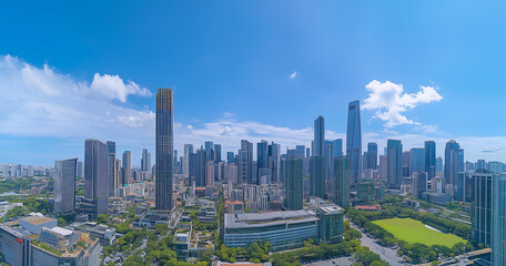 Aerial View of City Skyline and Skyscrapers Under Blue Sky and White Clouds
