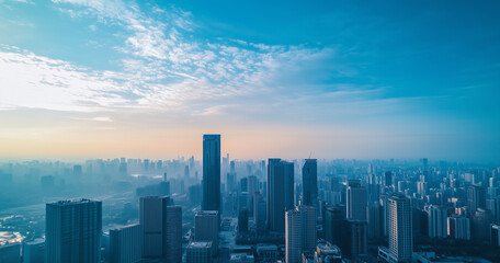 Fototapeta premium Aerial View of City Skyline and Skyscrapers Under Blue Sky and White Clouds