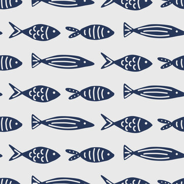 Blue painted fish swimming to the right. Seamless vector background of drawn simple fish.