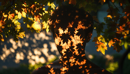 Position people in dappled sunlight under trees, letting the shadows of leaves play on their faces and bodies, creating natural, intricate patterns