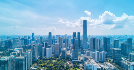 Fototapeta premium City Skyline and Skyscrapers Under Blue Sky and White Clouds Aerial View