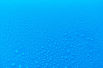 Top view of rain droplets on ocean blue cover background. Rain droplets and wallpaper design concept