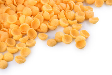 corn snack cheese flavor top view in shell-shaped corner isolated background portion spread close-up