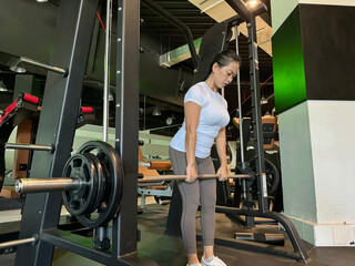 40 year old Asian woman enthusiastic about exercising to maintain muscle and fitness. Healthy lifestyle of women in middle age.