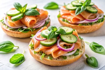 Freshly prepared salmon sandwiches on toasted bagel with salted fish, cucumber, onion, and basil, arranged artfully on a white background, perfect for a healthy breakfast.