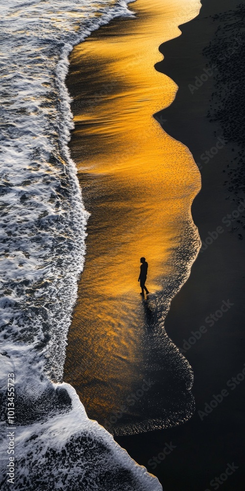 Wall mural A stunning beach scene captures a silhouette walking along the shoreline. The warm golden light reflects on the water. This image evokes tranquility and peacefulness. AI