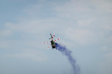 A military helicopter pilot demonstrates the technical skills and capabilities of the helicopter