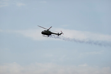 A military helicopter pilot demonstrates the technical skills and capabilities of the helicopter