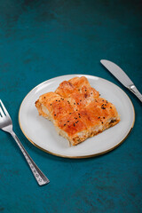 Plate of Turkish Cheese Borek with Fork and Knife – Flaky Pastry with Sesame Seeds, Ideal for Traditional Turkish Cuisine and Mediterranean Food Presentations