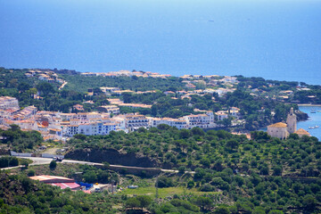 view from the hills to the village Cadaqués at the Mediterranean Sea, landscape with hills and trees, Catalonia, Spain