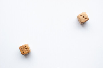 These are photos of wooden dice on a white background. They include shots of aligned, scattered, and stacked dice There are photos of a single die, a pyramid of dice.