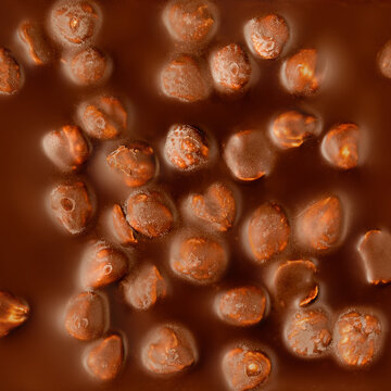 Chocolate bar textured background. Milk chocolate  texture with nuts. Pattern. Wallpaper