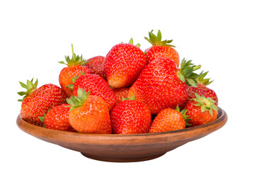 strawberries in a clay bowl isolated on a white background.