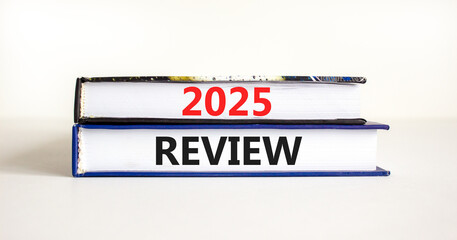 Planning 2025 review new year symbol. Concept words 2025 Review on beautiful books. Beautiful white background. Business 2025 review new year concept. Copy space.