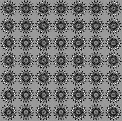 Abstract floral pattern in black and white on a gray background