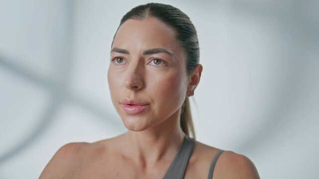 Yogi woman practicing breathing exercises indoors closeup. Lady inhaling asana