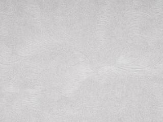 Sweeping gray contours evoke a serene, textured elegance on this paper surface, hinting at...