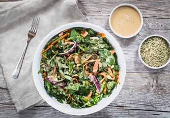 Fresh spinach tahini salad with a creamy tahini dressing. A healthy, vegan, and gluten-free dish perfect for clean eating and Mediterranean cuisine.