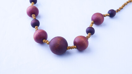 Vintage handmade women's jewelry, made of wood, close-up, on a white background, accessory, fashion, style, uniqueness, beauty