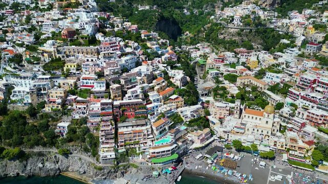 Positano, Italian coastal town with colourful cliffside homes, blue sea, and beaches