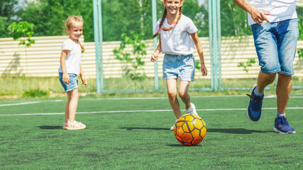 Obraz premium Active family football in free time