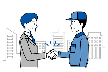 ビル群を背景に握手をするスーツの男性とつなぎ作業服の男性