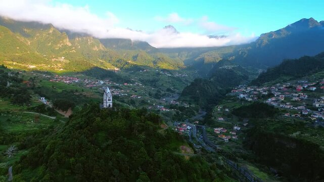 Amazing Chapel of Saint Fatima on the green mountain. Splendid view of Sao Vicente valley hiding in the mountains. The Madeira Islands, Portugal. Aerial view.