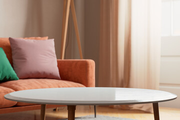 A stylish living room with a modern sofa and a well-designed coffee table