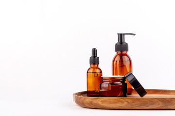 Natural facial cosmetic products on white background, top view. Set skin care bottle, cleanser, moisturize.